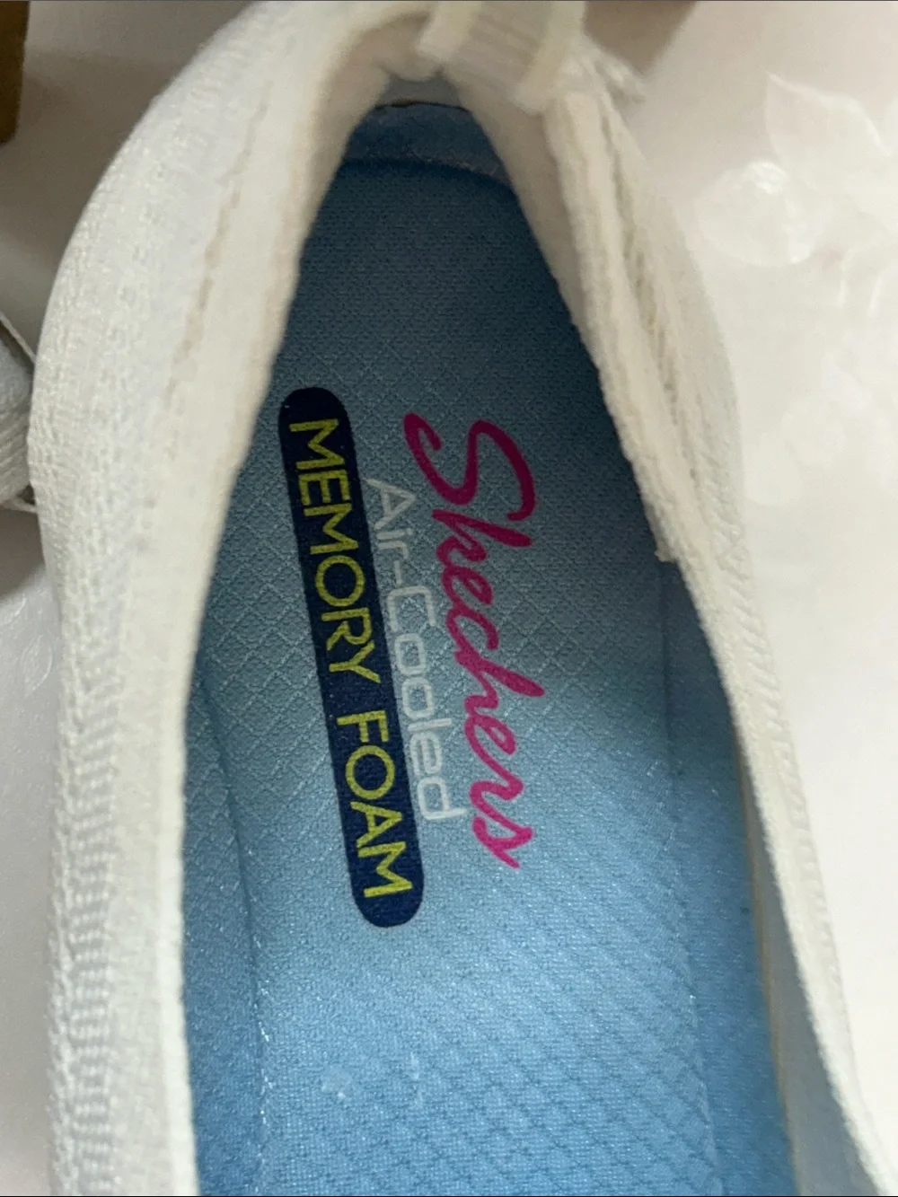 Skechers Women’s White Slip-On Knit Sneakers